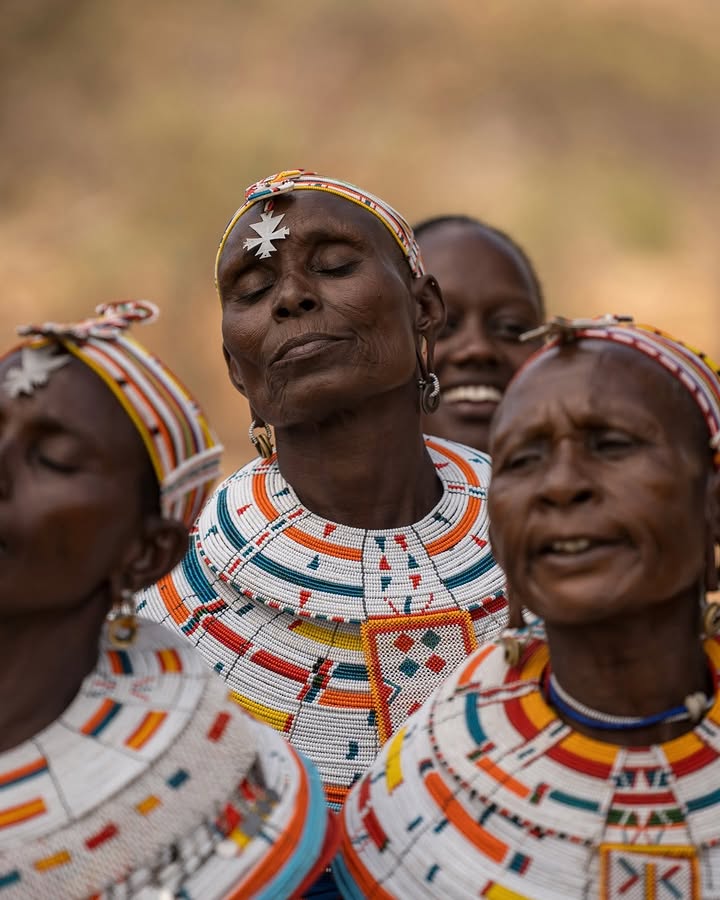 Samburu women in traditional beaded collars singing on a women only safari in Kenya