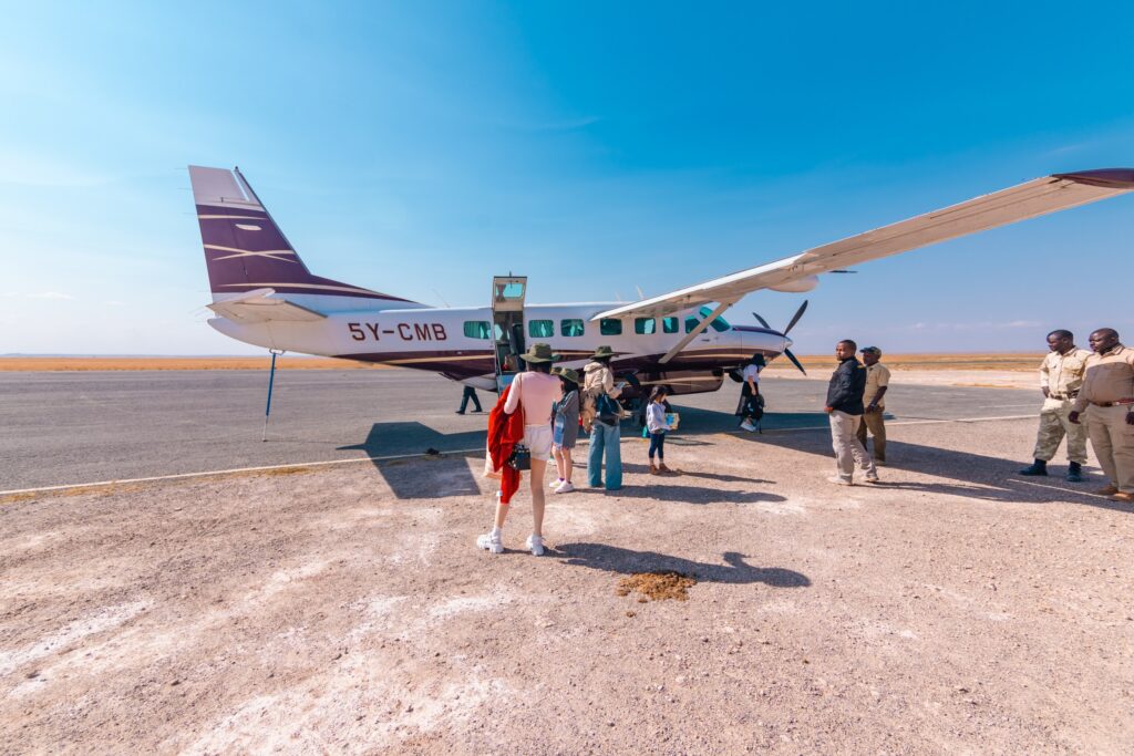Safari plane landing in the Masai Mara following a seamless JKIA arrival and transfer